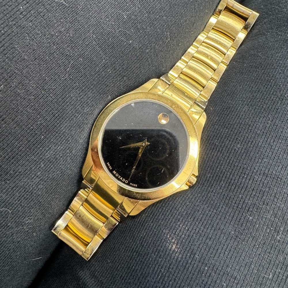 Movado Gold Watch with Black Face